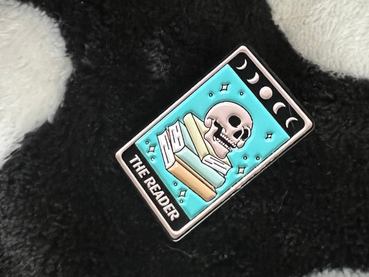The reader enamel pin